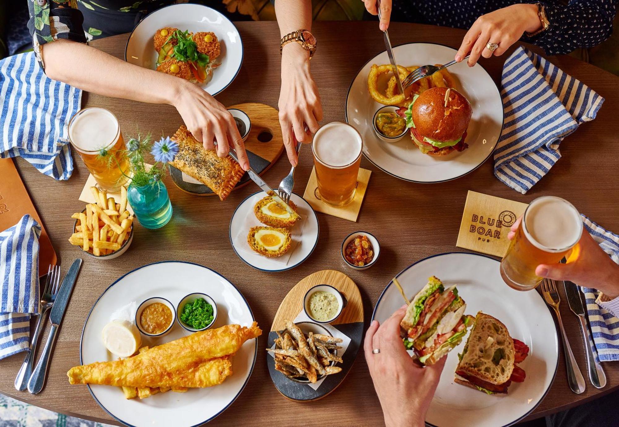 Conrad London St James Экстерьер фото A selection of dishes from the Blue Boar